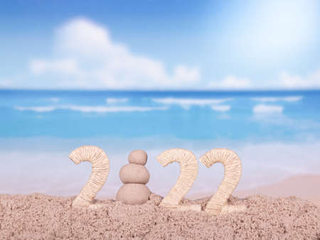 Happy 2022 design with beach backgroundの写真素材