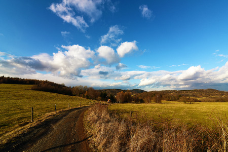 Path in winter sunny day in mountainsの写真素材