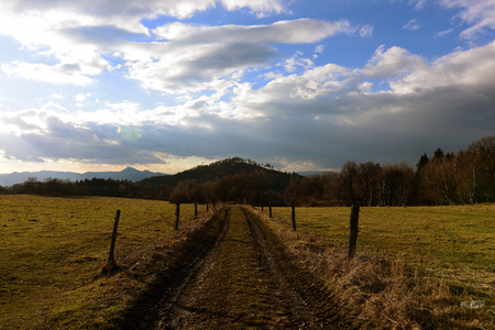 Path in winter sunny day in mountainsの写真素材