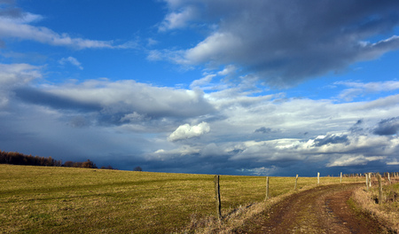 Path in winter sunny day in mountainsの写真素材
