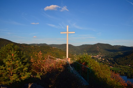 Cross on rock over valley of river Labeの写真素材