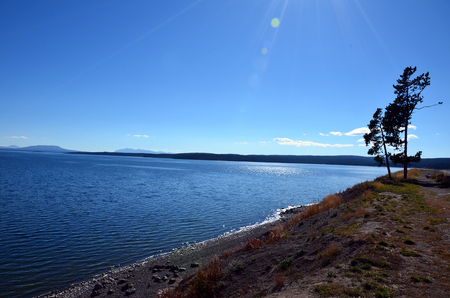 Coast near sea in Yellowstone with blue waterの写真素材