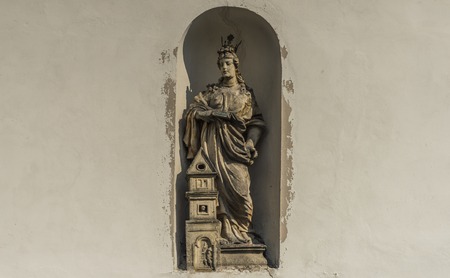 Statue on church wall in Dubicky village