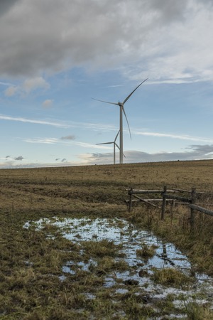 Wind power plant near Komari vizka hill in autumn time