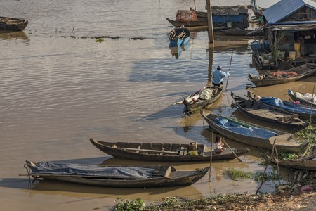 Boats and cottage near Tonle Sap lake in Cambodiaの写真素材