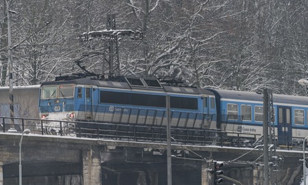 Blue electric engine on bridge in frosty cold winter day
