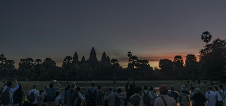 Angkor Wat temple before sunrise with tourist in Cambodiaの写真素材