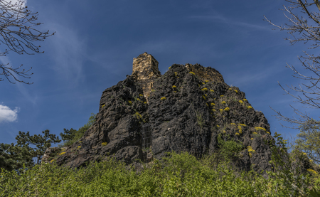 Kamyk village and ruin of castle in north of Bohemia in spring sunny dayの写真素材