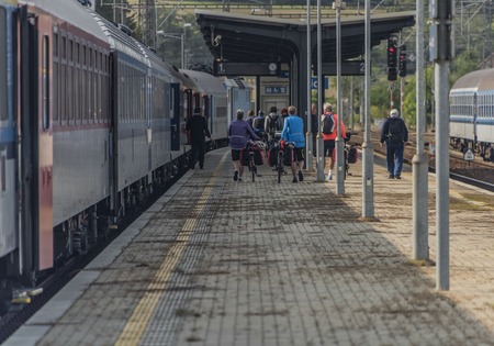 Passengers in station Olbramovice town in summer sunny day