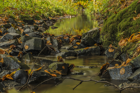 Stone trough near Chribska Kamenice river in national park Ceske Svycarsko in autumn morningの写真素材