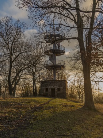 Observation tower on Varhost hill in autumn sunset eveningの写真素材