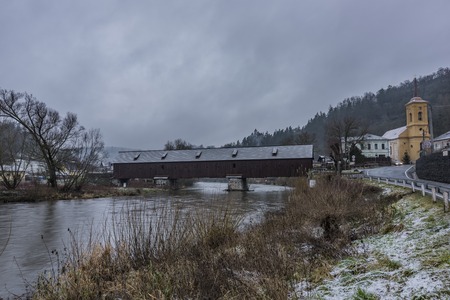 Cloudy morning in Radosov village with wooden old bridge
