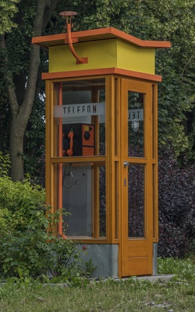 Old phone on street in Trest town in summer eveningの写真素材