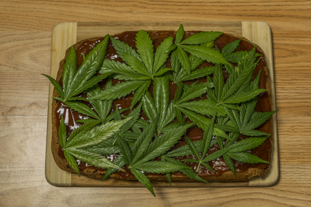 Marijuana gingerbread with orange briar marmalade and fresh leafsの写真素材