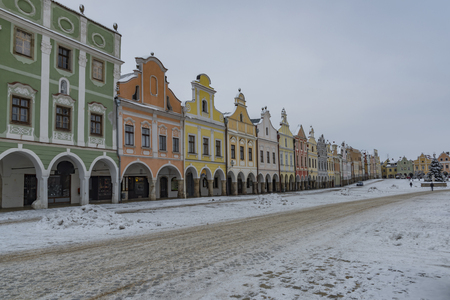 Square in old Telc town in winter dark cold morning with very old housesの写真素材