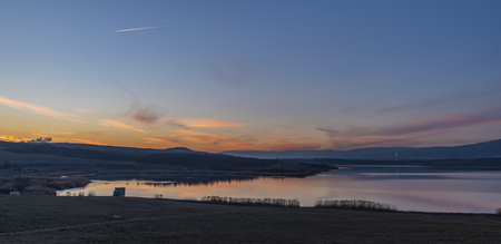 Milada lake in winter cold color evening in north Bohemiaの写真素材