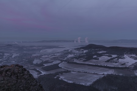 Sunrise on Boren hill near Bilina town in winter frosty color morningの写真素材