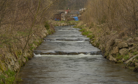 Svatava river in Kraslice town in Krusne mountains in spring cloudy dayの写真素材