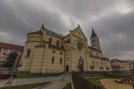 Big church in Kraslice town in dark cloudy spring day in north west Bohemiaの写真素材
