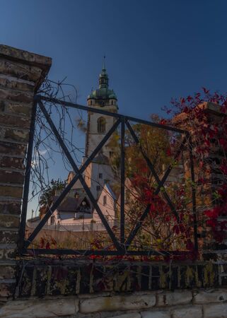 Church castle and old houses in old town Melnik in central Bohemia in autumn color eveningの写真素材