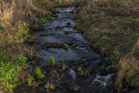 Hucivy creek in Perstejn village in winter nice color sunny morningの写真素材