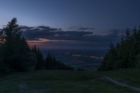 Black summer night over Trinec factory town with color lightsの写真素材