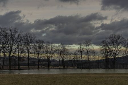Field and hills near Hreben pond village in color cloudy day in south Bohemiaの写真素材