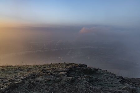 Sunrise time on Radobyl hill over valley of river Labe and Litomerice town in winter morningの写真素材