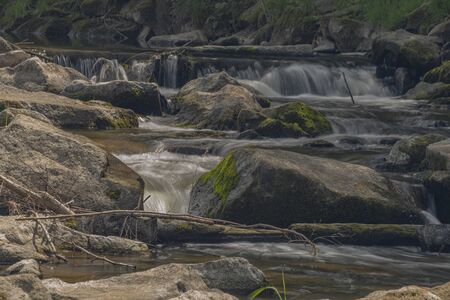Becva river in sunny spring light day in Beskdy mountains with big stones