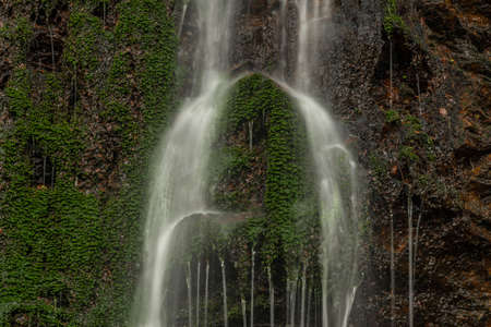 Waterfall near Kouty nad Desnou village in summer day in forest