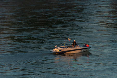 Bratislava capital in summer evening with color sunset boat and blue river Donau