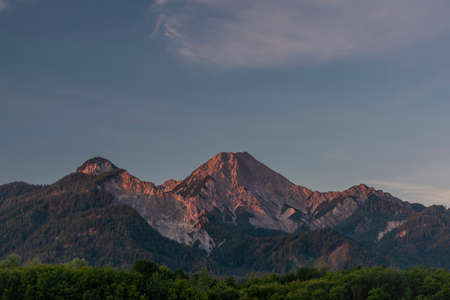 Red Mittagskogel hill in summer fresh blue sky color morningの写真素材