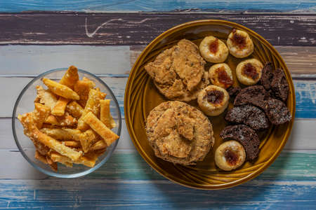 Salt cake with cheese on brown dish and wooden color table