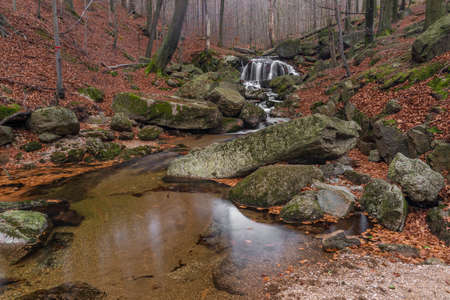 Maly Bily Stolpich waterfall in autumn fresh cold morning in Jizera mountainsの写真素材