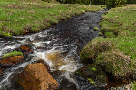 Rolava river with fresh meadows and forests in Krusne mountainsの写真素材