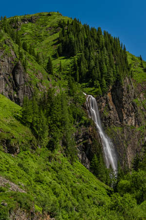 Schleierfall waterfall near Sportgastein place between big color summer mountainsの写真素材