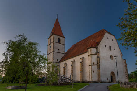 Semriach village with white church in sunny summer morning in Austriaの写真素材