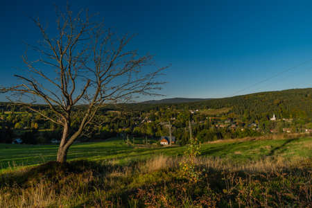 Bedrichov village in autumn sunny evening with sunset light in north Bohemiaの写真素材