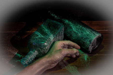 Old color glass bottle with fresh light and old dirty cobweb