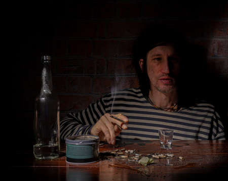 Black hair man with alcohol brown wooden table interior