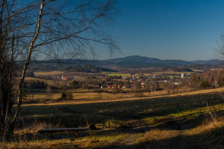 Kajov village with big church with high tower in winter blue sky color dayの写真素材