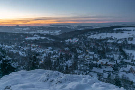 View near Tisa village in winter snowy morning before orange sunriseの写真素材