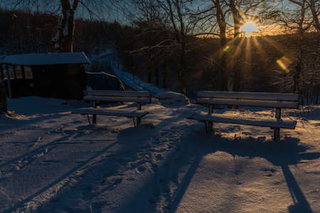 View near Tisa village in winter snowy morning before orange sunriseの写真素材