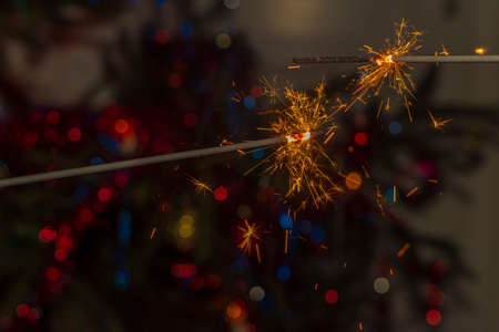 Detail of Christmas spruce tree with red and blue colors and presents in paper boxesの写真素材