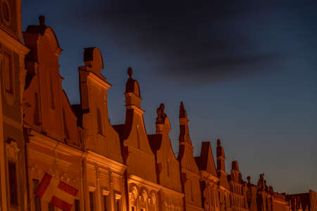Telc town in winter black night with orange street lampsの写真素材