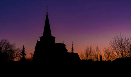 Church in LItovel town with sunrise colors on sky in winter morningの写真素材