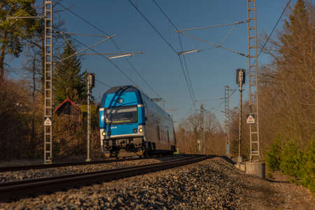 Fast passenger train near Senohraby station in sunny winter cold dayの写真素材
