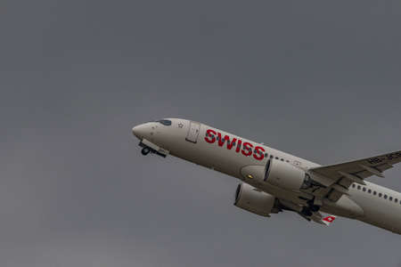 Takeoff of airplanes in Zuich airport in spring 2022 04 03 in cloudy evening