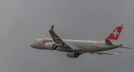 Takeoff of airplanes in Zuich airport in spring 2022 04 03 in cloudy eveningのeditorial素材