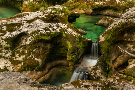 Mostnica small river with color surroundings in Slovenia summer mountainsの写真素材